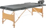 Ein tragbarer Massagetisch mit verstellbarem Kopfteil.