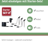 Ein Beleuchtungsset mit Leuchten, Kabel und Trafo.