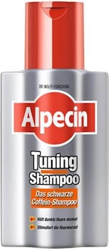 Ein silberner Flaschen-Shampoo mit rotem Deckel.