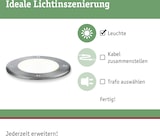 Eine runde Leuchte mit Schrauben und Licht.