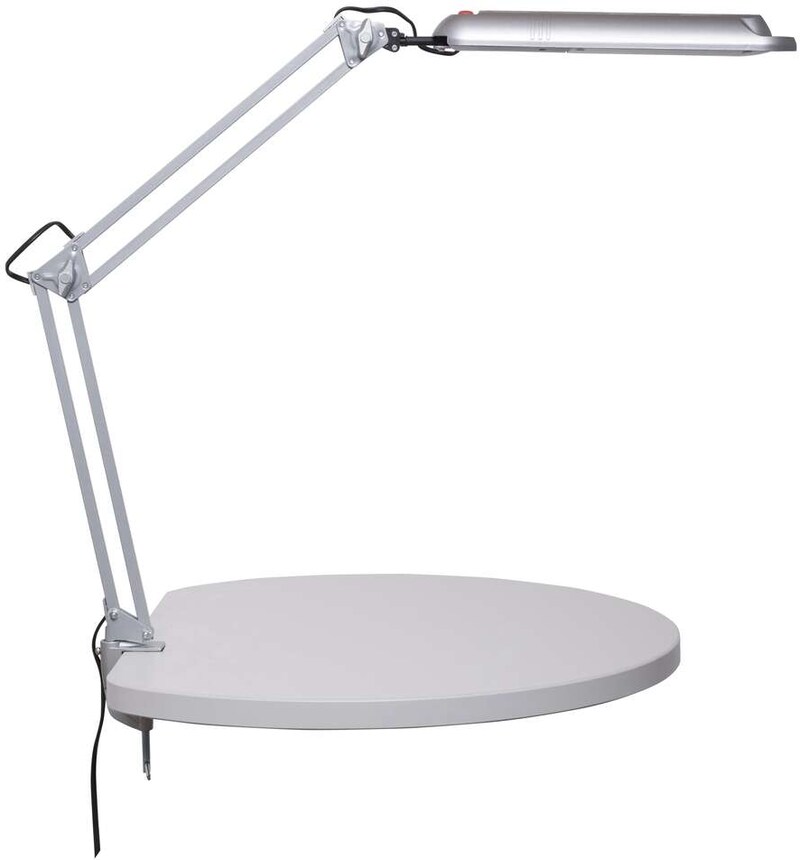 Eine silberne Schreibtischlampe mit einem runden Sockel.