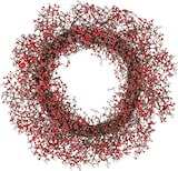Ein Kranz mit roten Beeren.