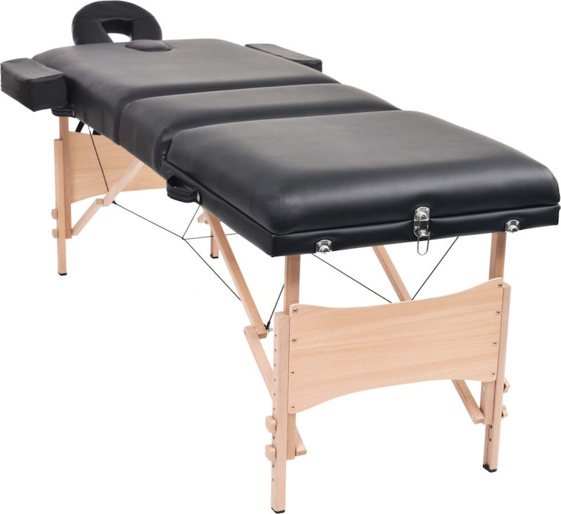 Ein tragbarer Massagetisch mit Holzrahmen.