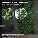 Eine grüne Wand mit realistischen Blättern.