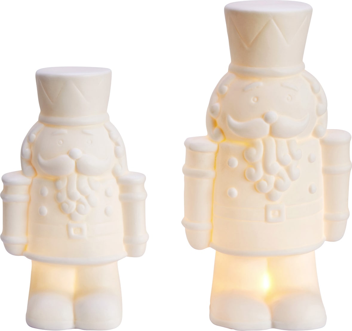 Zwei weiße Nussknacker-Figuren mit Lichtern.