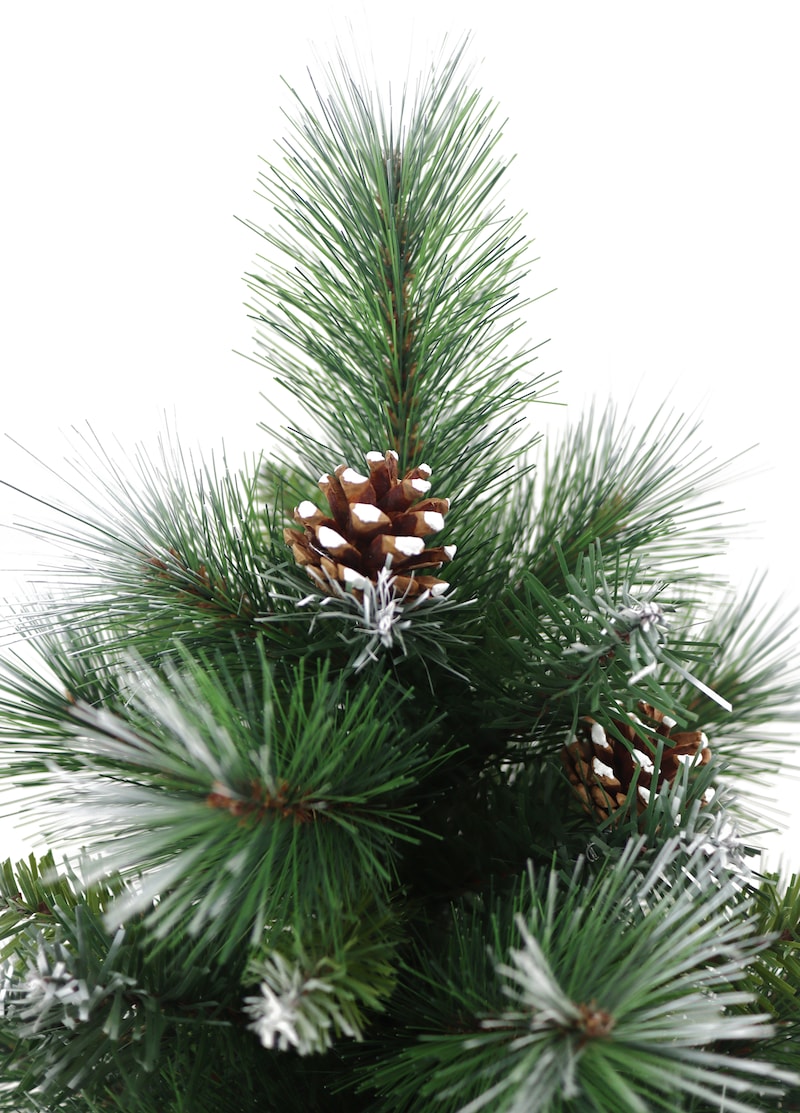 Un albero di Natale artificiale con pigne e neve.