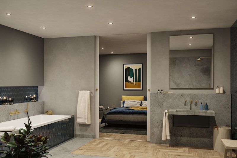 Ein modernes Badezimmer mit angrenzendem Schlafzimmer.