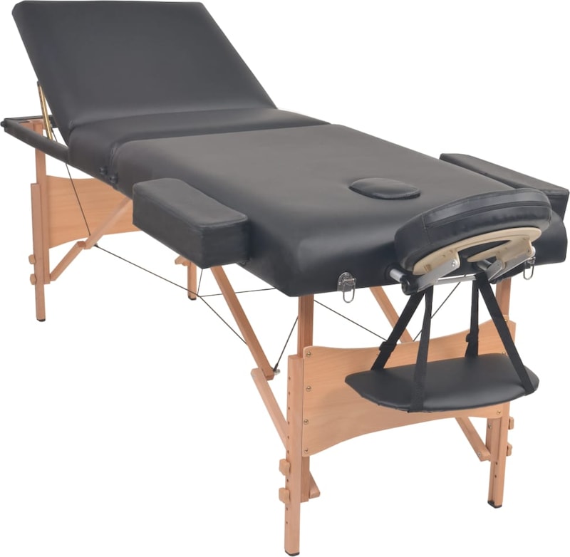Ein schwarzer Massagetisch mit Holzrahmen.