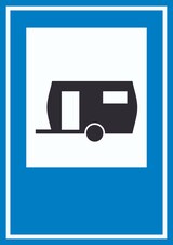 Ein Wohnwagen auf einem blauen Schild.