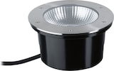 Un luminaire rond encastré avec boîtier noir.