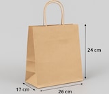Una bolsa de papel marrón con asas.