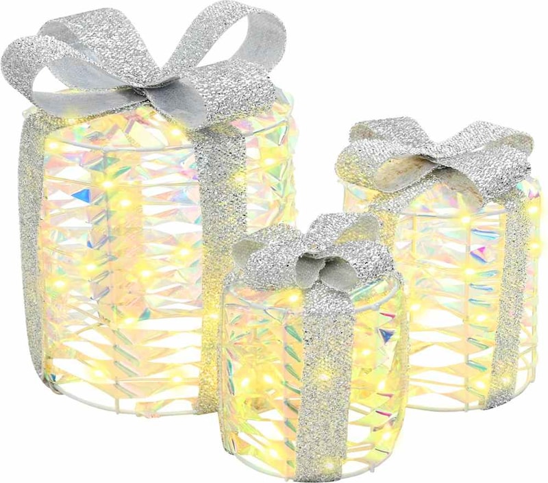 Drei beleuchtete Geschenkboxen mit silbernen Schleifen.