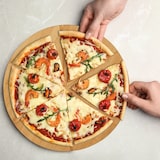 thumbnail of Relaxdays Pizzabrett Bambus 2er Set, runde Pizzateller 33 cm Ø, inkl. Backpapier, Pizza Schneidebrett mit Rillen, natur