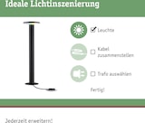 Eine Stehleuchte mit Kabel und Trafo.