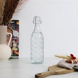 thumbnail of Garrafa de vidro com tampa basculante de 1 litro – Vidro transparente com padrão de bolhas – Transparente