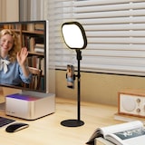 Ein Ringlicht mit Handyhalterung auf einem Schreibtisch.