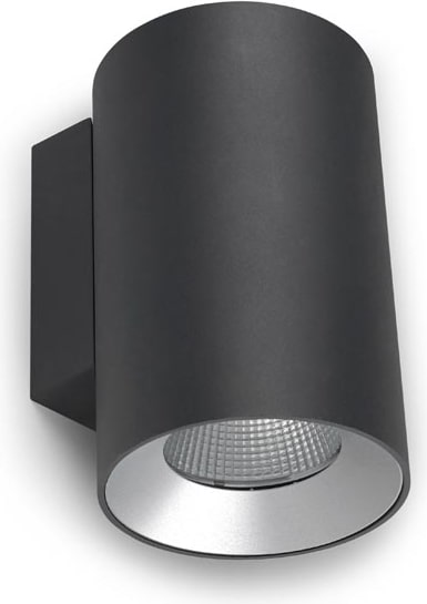 Una lámpara de pared cilíndrica negra con borde plateado.