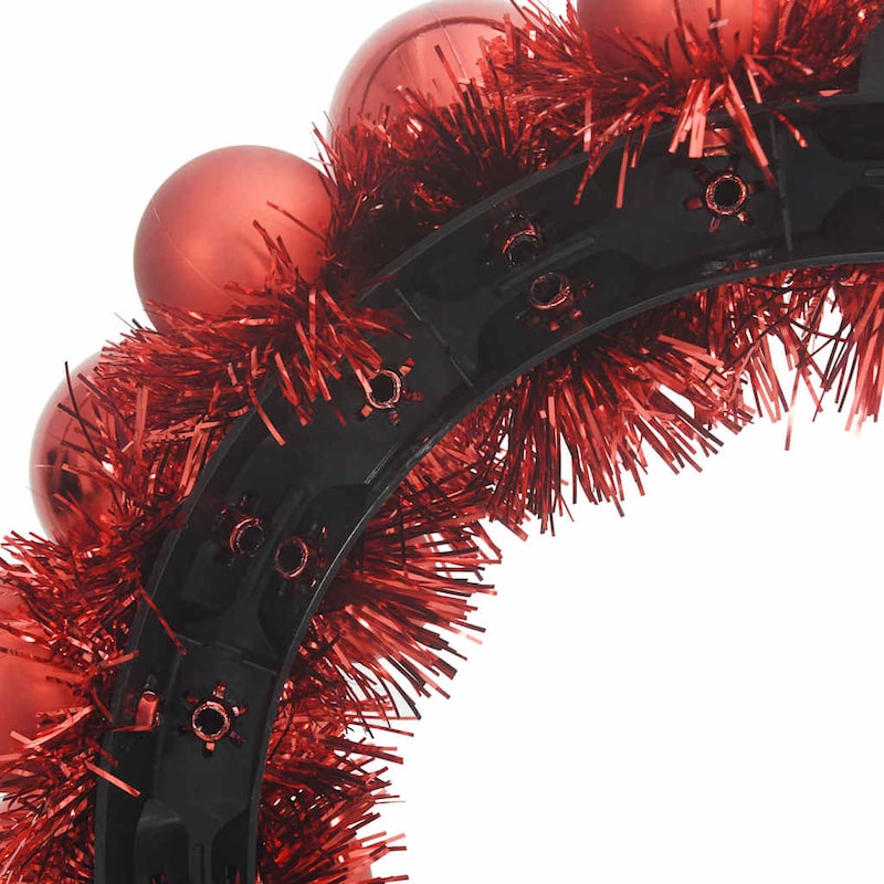 Ein Stirnband mit roten Weihnachtskugeln und Lametta.