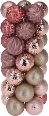 Eine Gruppe von rosafarbenen und goldenen Weihnachtskugeln.