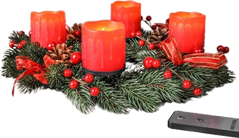 Ein Adventskranz mit vier roten Kerzen.