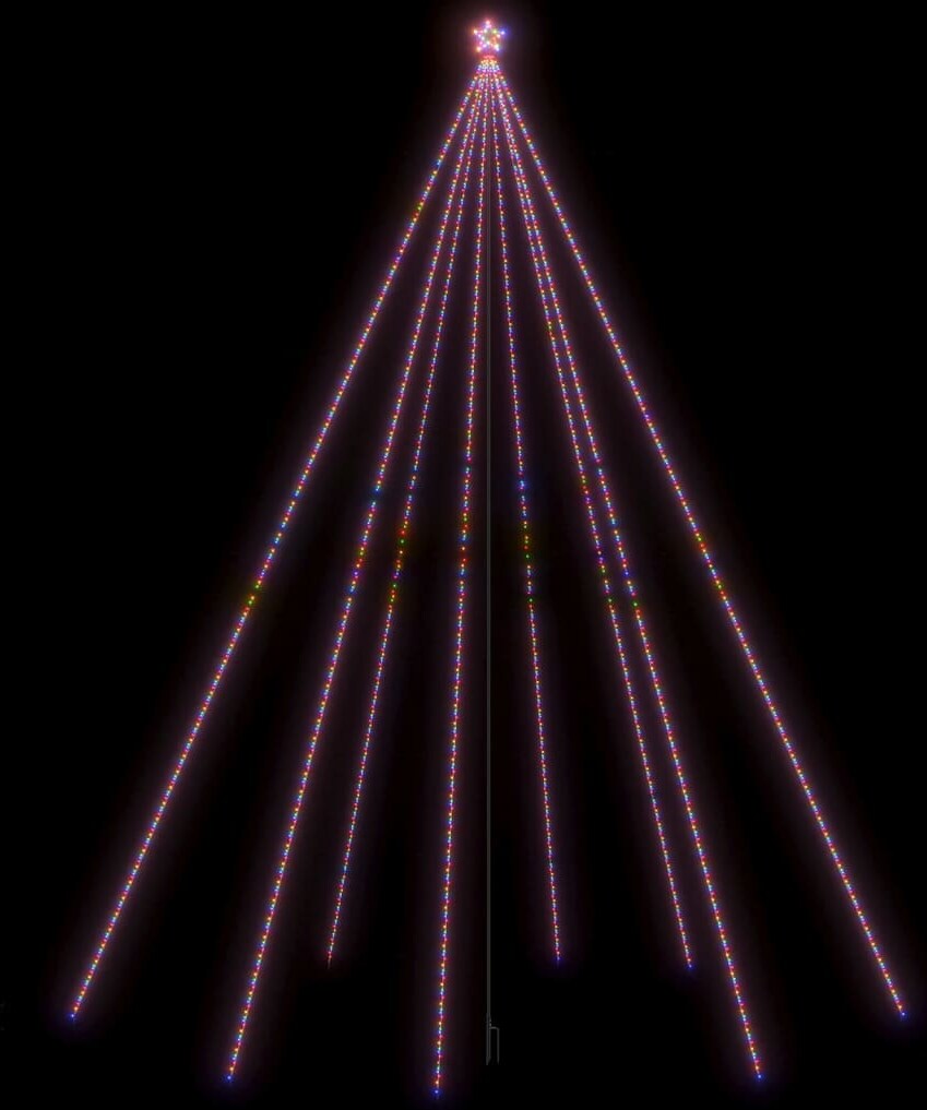Ein Stern über einem Lichterbaum.