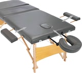 Ein verstellbarer Massagetisch mit Gesichtslaugenhalterung.