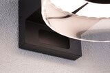 Ein moderner schwarzer Wandleuchter mit Glaskolben.