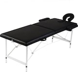 Ein schwarzer Massagetisch mit verstellbarem Kopfteil.