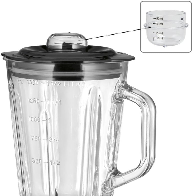 Um recipiente de vidro com marcações de medição e uma tampa.