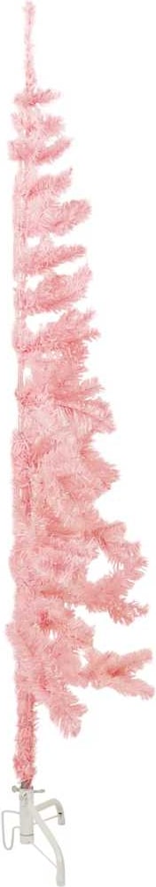 Ein rosa Weihnachtsbaumständer mit Zweigen.