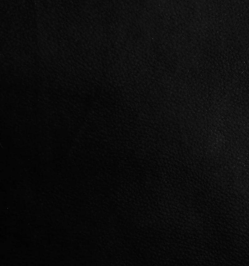 Schwarzes Leder mit Textur.