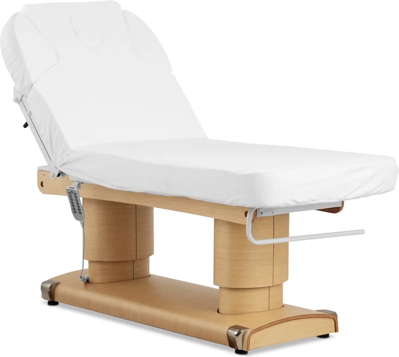 Ein weißer Massagetisch mit Holzsockel.