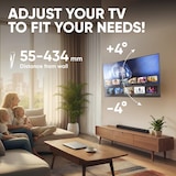 Un televisor está montado en un soporte de pared.