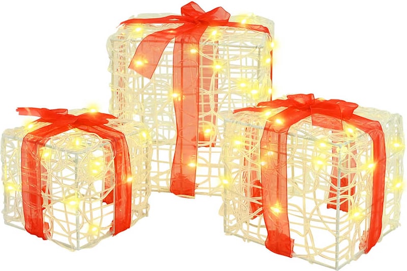 Drei beleuchtete Geschenkboxen mit roten Schleifen.