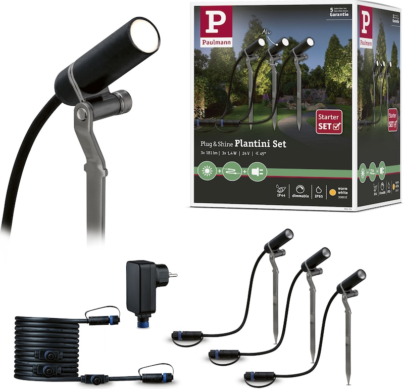 Ein Set von drei Gartenleuchten mit Erdspießen.