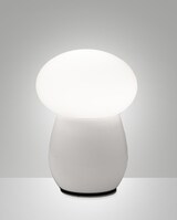 Eine weiße Pilzlampe auf einem Tisch.