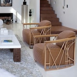 thumbnail of Now's Home - Fauteuil cuir noisette matelassé et structure inox cuivré