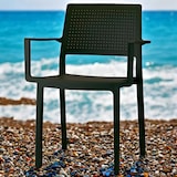 thumbnail of Cadeiras de braços na cor preto para hotelaria "Emi". Mobiliário empilhável para terraço, interiores e exteriores de restaurantes e cafeterias.