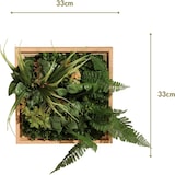 Un marco de plantas artificiales con helechos y hojas.