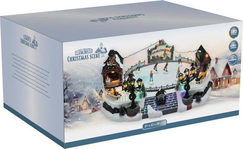 Eine beleuchtete Weihnachtsszene mit einer Eisbahn.
